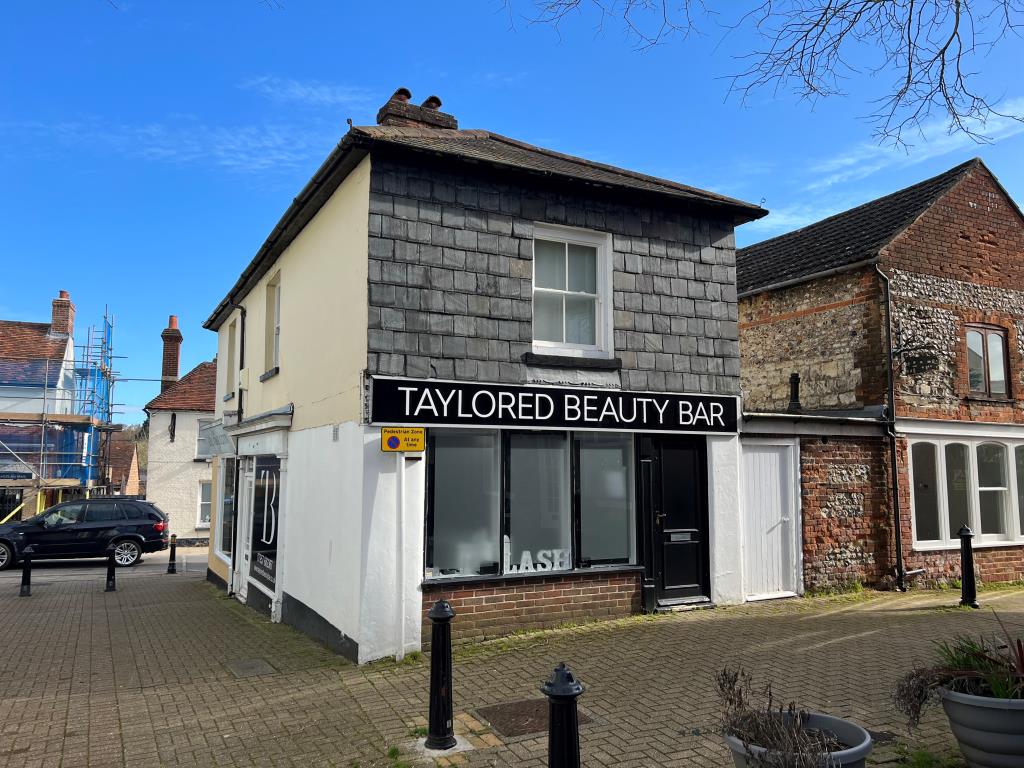 Lot: 5 - FREEHOLD TOWN CENTRE INVESTMENT - Rear view of a pair of shops in Alton Town Centre